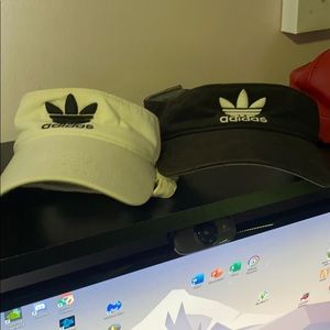 Black and white Adidas visors
